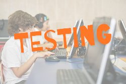 students testing on computers